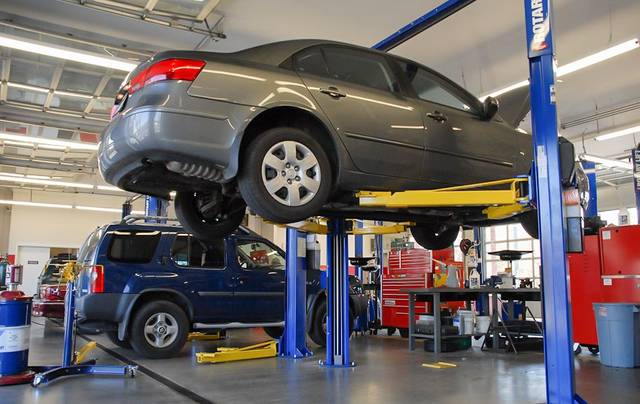 Mechanic replacing a fuel pump